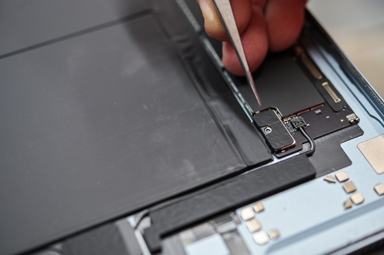Professional technician fixing an iPad screen